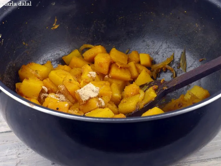 Step 38 – Add the dry mango powder, mix well and cook on a medium flame for 1 …