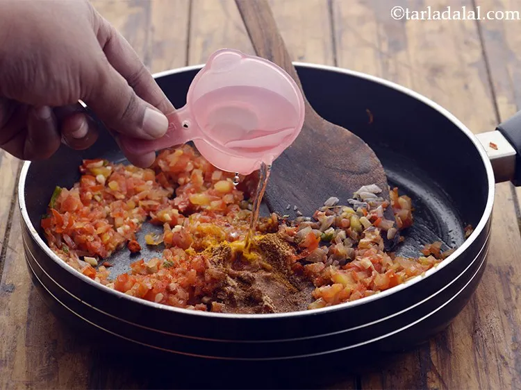 Step 16 – Pour &frac14; cup of water. This will prevent the spices from burning.