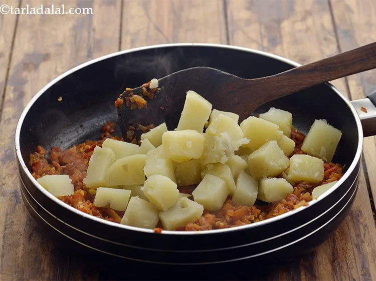 Step 18 – Add the potatoes.