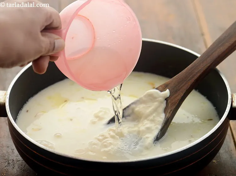 Step 14 – Add 1&frac12; cups of water. Add more or less water as per the consistency of …