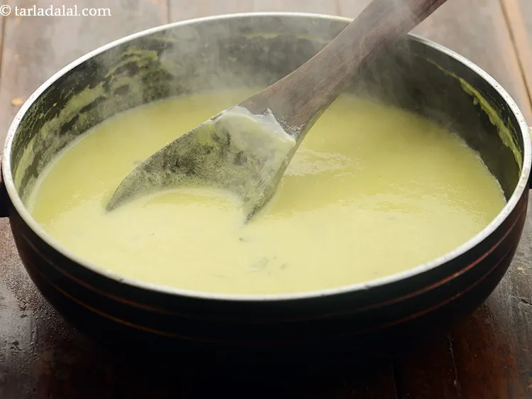 Step 19 – Simmer <strong>pyaaz ki kadhi</strong> on a slow flame for more 8 to 10 minutes or …