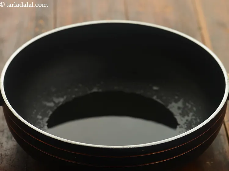 Step 5 – To temper, <strong>Punjabi kadhi</strong> heat the oil in a pan. To make it more authentic …