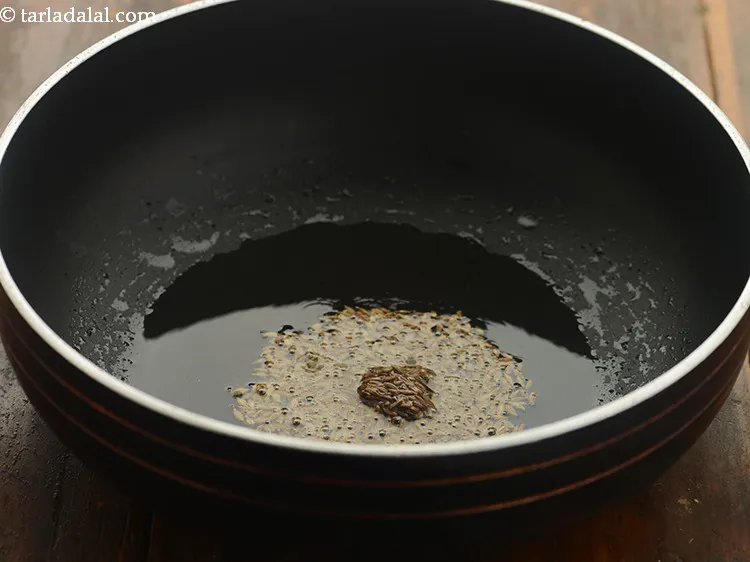Step 6 – Once the oil is hot, add the cumin seeds.