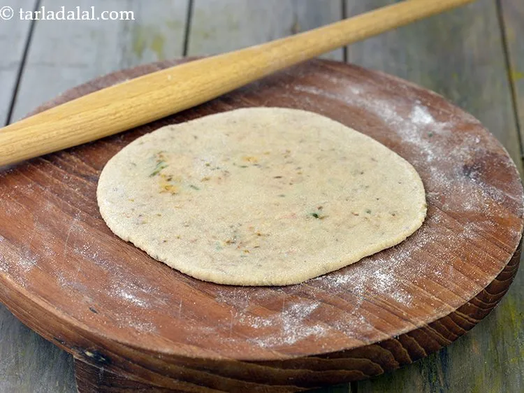 Step 33 – Roll out again into a 150 mm. (6&quot;) diameter circle using a little whole wheat …