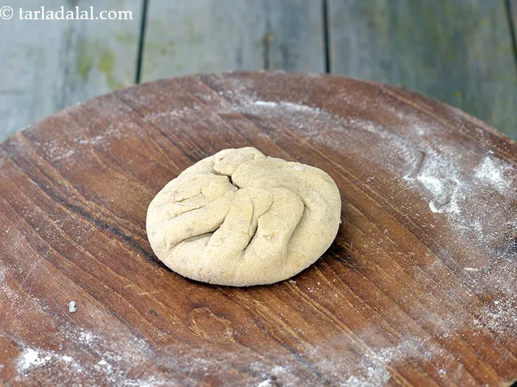 Step 32 – Bring together all the sides in the centre and seal it tightly and flatten it. …