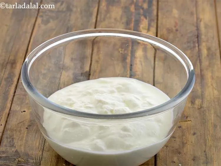 Step 11 – In a large bowl put the curd.