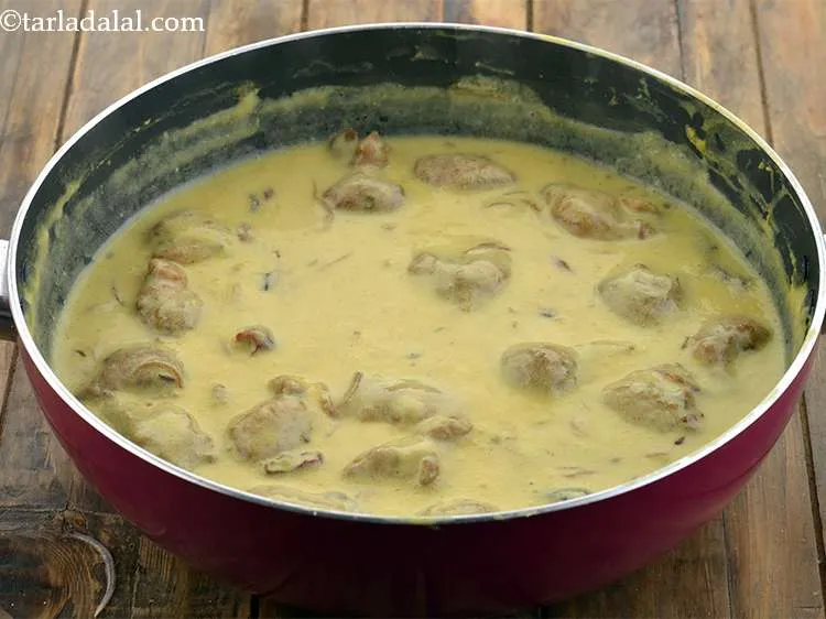 Step 23 – Now add the pakodas and cook on a medium flame for 5 minutes, while stirring …