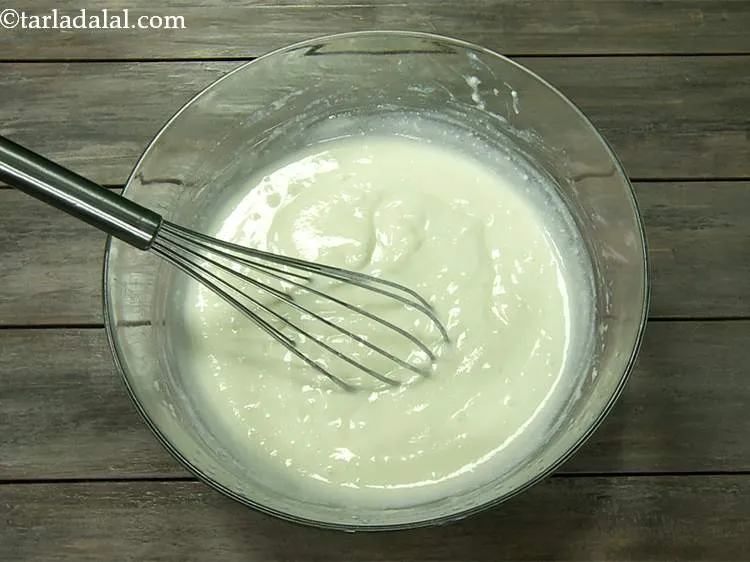 Step 4 – Now whisk the curd till smooth. Make sure the sugar has been properly mixed in …
