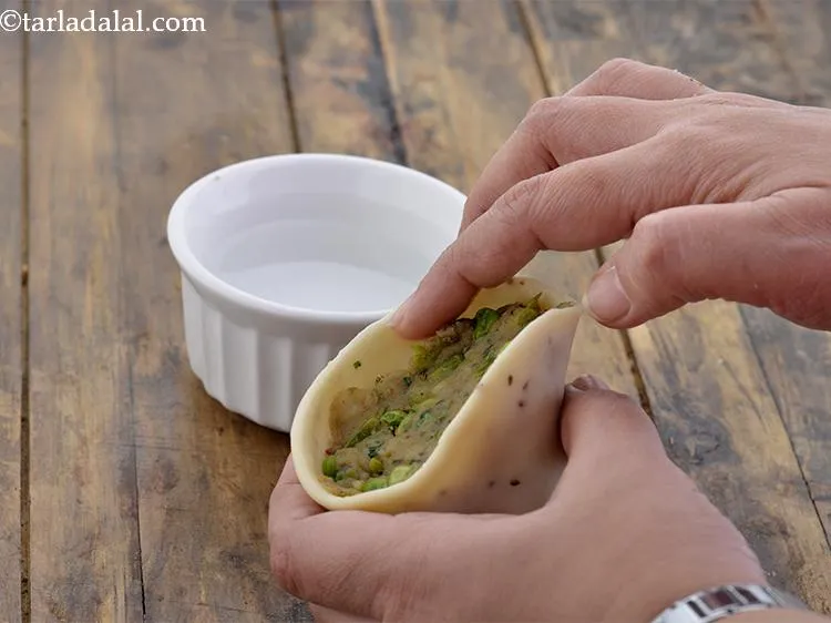 Step 31 – Apply a little water on the edges and press to seal.