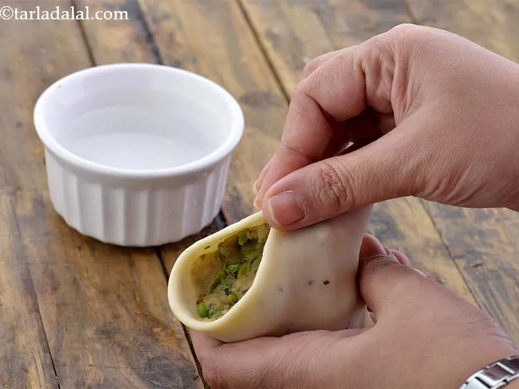 Step 32 – Once sealed press the edge on your palm. Repeat with the remaining dough to stuff …