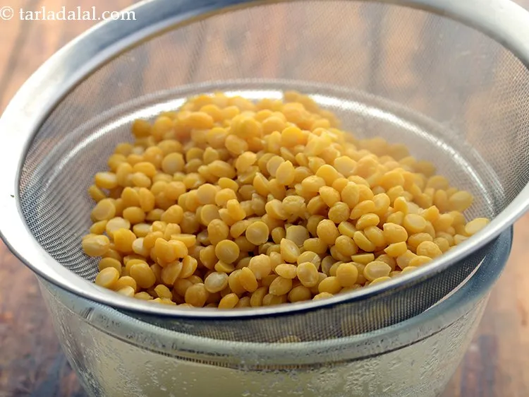 Step 8 – Drain the dal. Make sure the dal does not turn mushy at this stage.&nbsp;