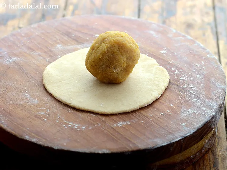 Step 23 – Roll out the dough into 4&rdquo; circle and place one portion of the <strong>puran poli</strong> …