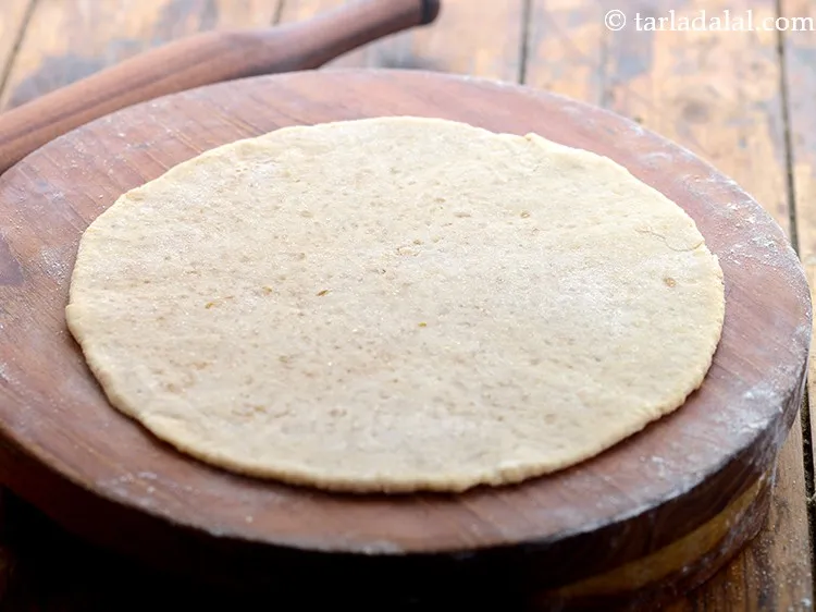 Step 25 – Roll out the<strong> Maharastrian puran poli</strong> into an 8&rdquo; circle using little whole wheat flour. …