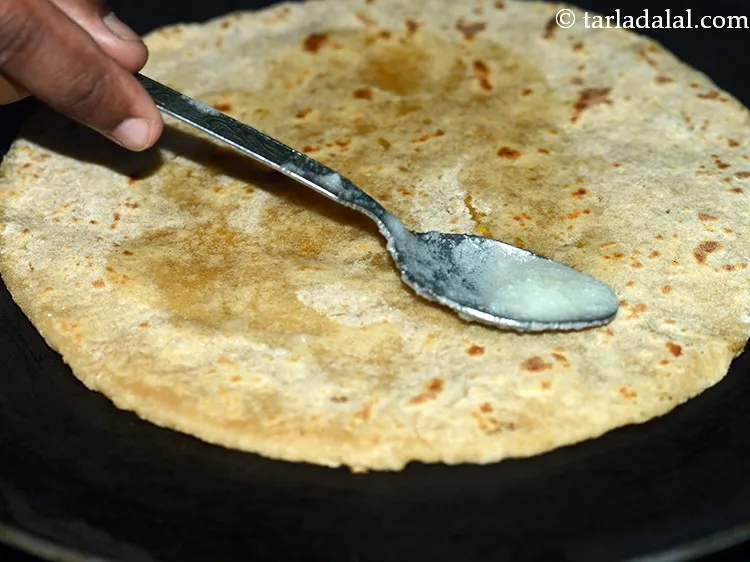 Step 28 – Apply 1 tsp ghee on each side while cooking.&nbsp;