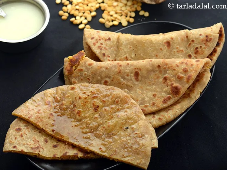 Step 30 – Serve the <strong>Maharahtrian style puran poli</strong> hot with ghee and <a href="https://www.tarladalal.com/Katachi-Amti-Alavani-Amti-42418r">Katachi amti</a>&nbsp;or <a href="https://www.tarladalal.com/Potato-Bhaji-Aloo-Bhaji-1661r">Potato …