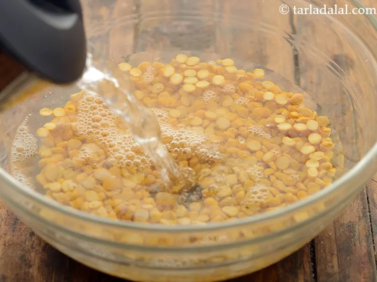 Step 3 – Add enough water to soak the chana dal.&nbsp;
