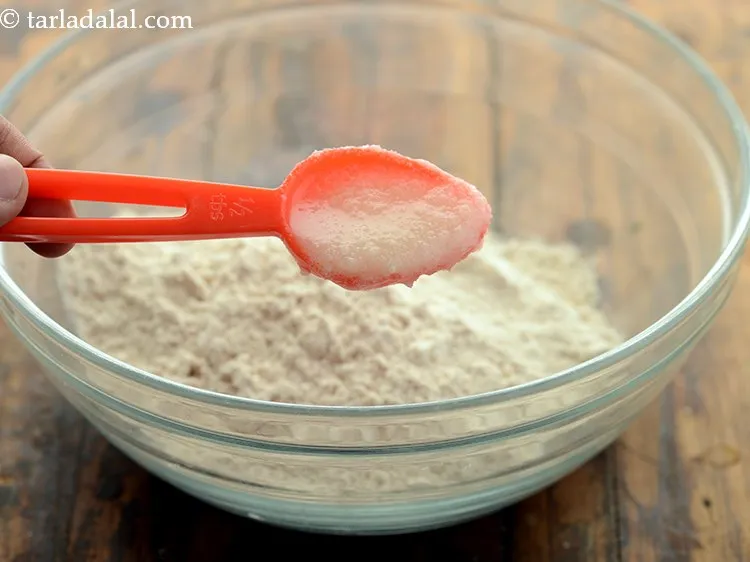 Step 18 – Add ghee, ghee makes the dough soft in texture.