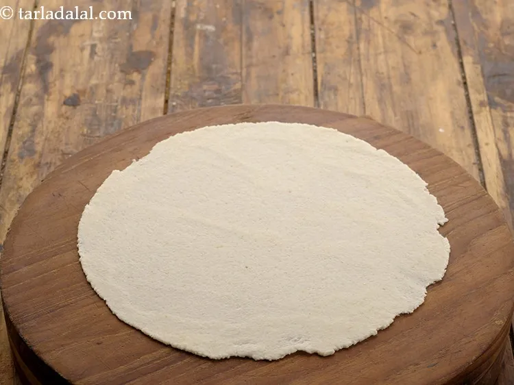 Step 40 – Roll a portion of the dough into 175 mm. (7&rdquo;) diameter circle without using any …