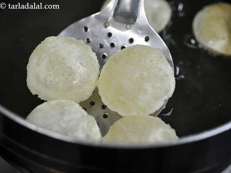 Step 46 – Flip and fry the puri till golden brown in colour and crisp from both sides. …