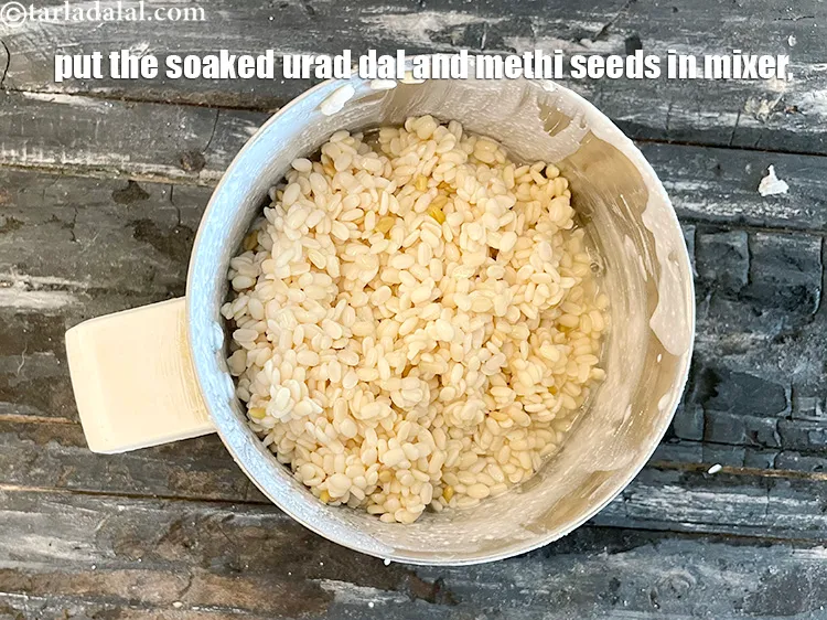 Step 21 – In a mixer, put the soaked urad dal and methi seeds.