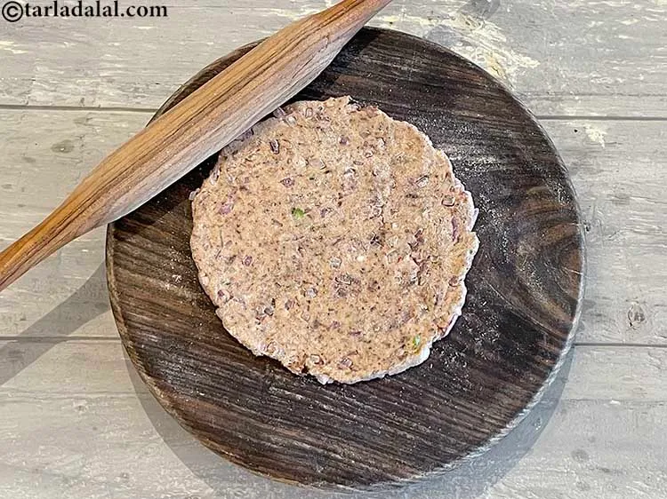 Step 18 – Roll each portion into a 125 mm. (5&rdquo;) diameter circle using a little whole wheat …