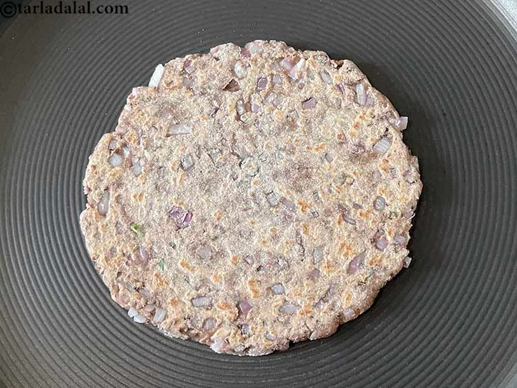 Step 19 – Heat a non-stick tava (griddle) and cook each <strong>Punjabi paratha with anardana - dhaba style …