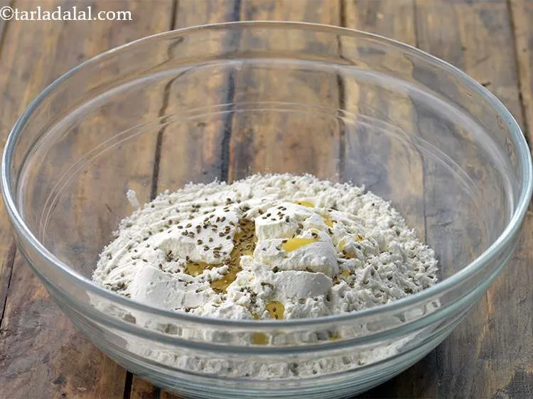 Step 30 – A pinch of carom seeds can also be added to the dough along with salt …