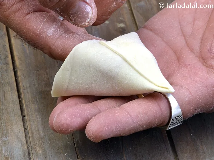 Step 23 – Take a portion and join the edges to make a cone.