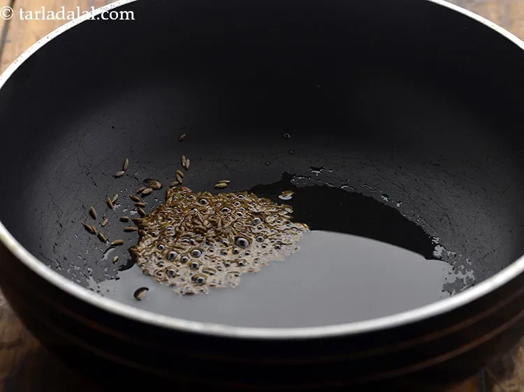 Step 5 – Once the oil is hot, add the cumin seeds.