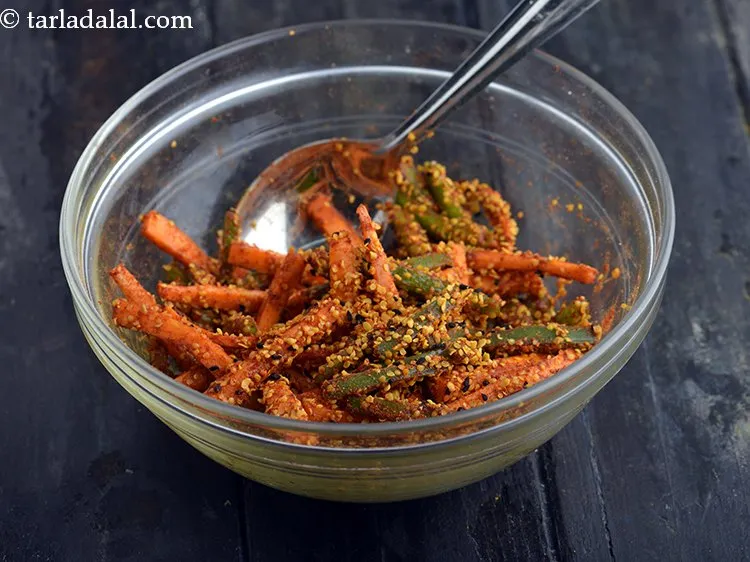 Step 13 – Mix <strong>gajar shimla mirch ka achar</strong> well using a spoon.