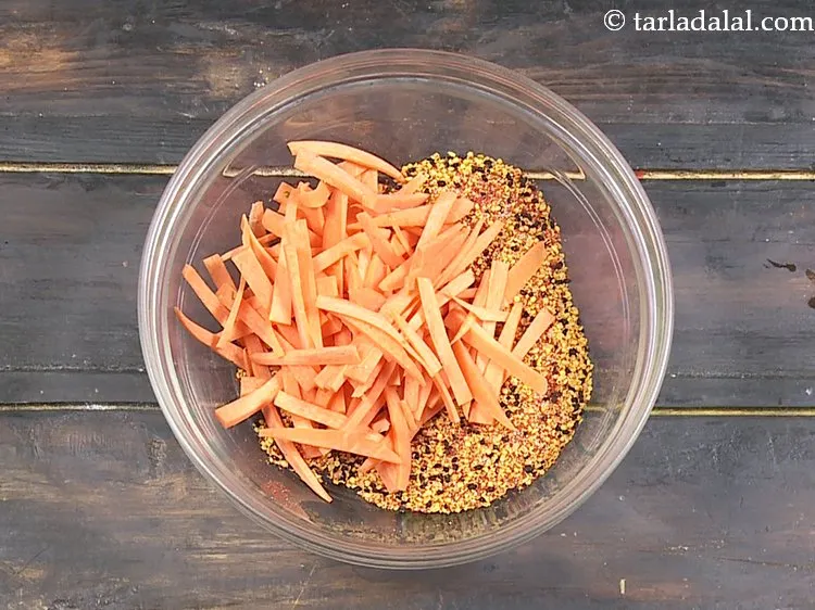 Step 9 – Next to make i<strong>nstant carrot capsicum pickle</strong>, add carrot juliennes to it. To make carrot …