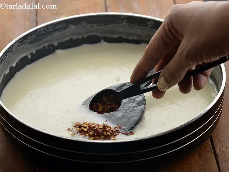 Step 13 – Add chilli flakes, you can adjust the quantity according to your preference of spiciness.