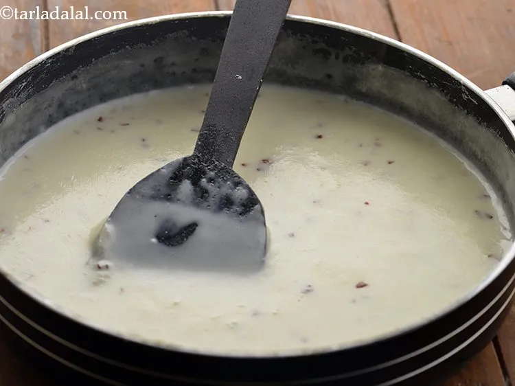Step 14 – Mix well and cook <strong>Cheese Fondue</strong> on medium flame for 2 minutes.