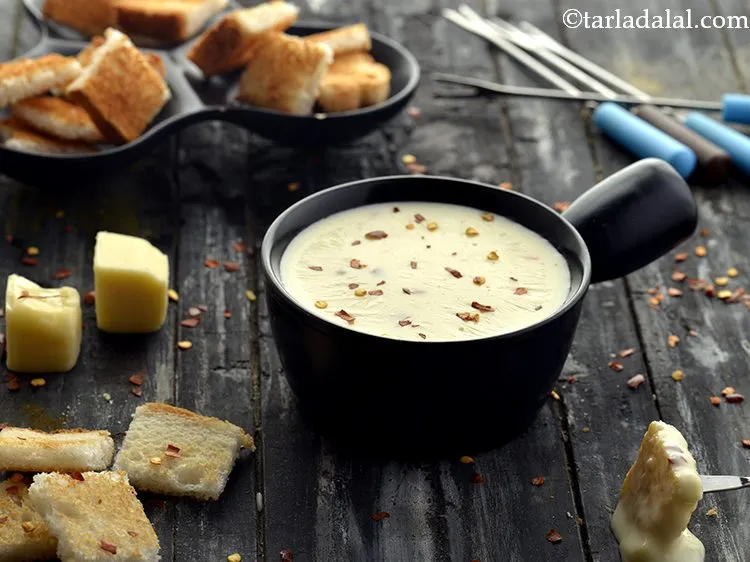 Step 15 – Serve <strong>Cheese Fondue</strong> immediately with toasted bread pieces.