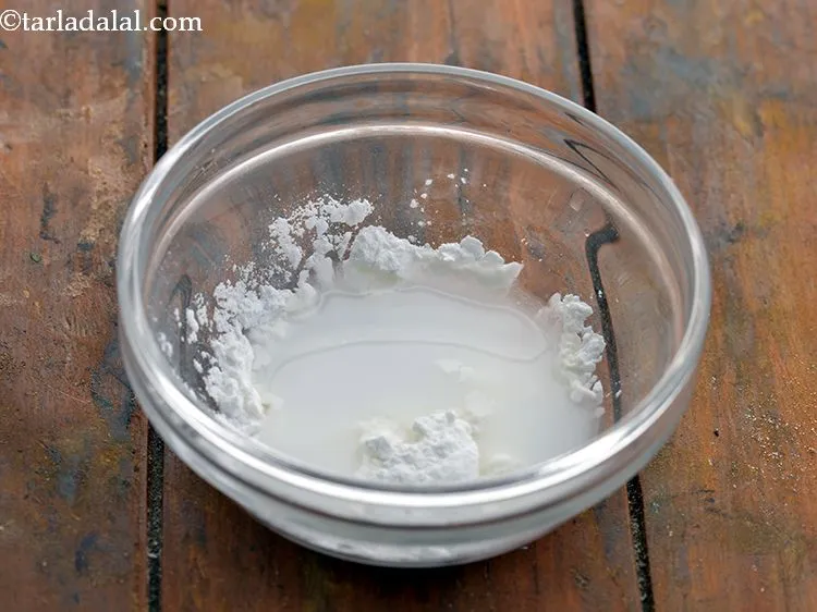 Step 3 – Add 1 tbsp of water to the bowl of cornflour.