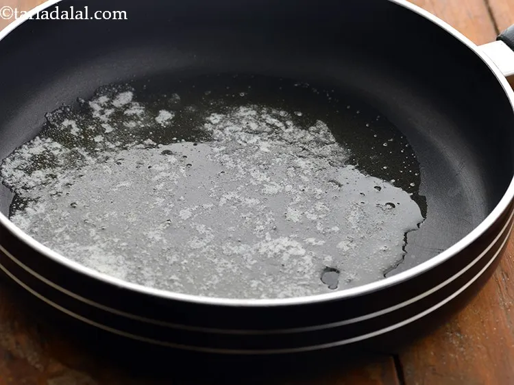 Step 5 – Heat butter in a non-stick broad pan.