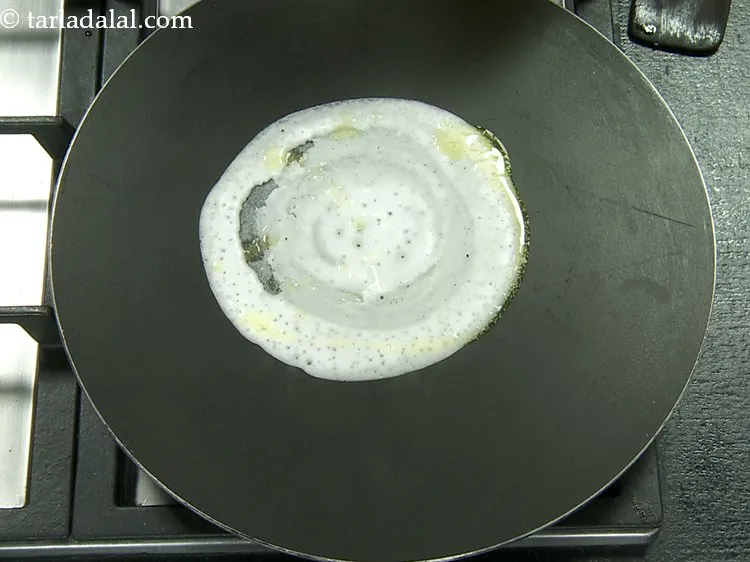 Step 17 – Smear a little butter over it and along the edges and cook on a medium …