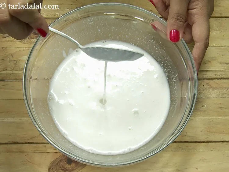 Step 12 – Mix well to form a flowing consistency dosa batter.