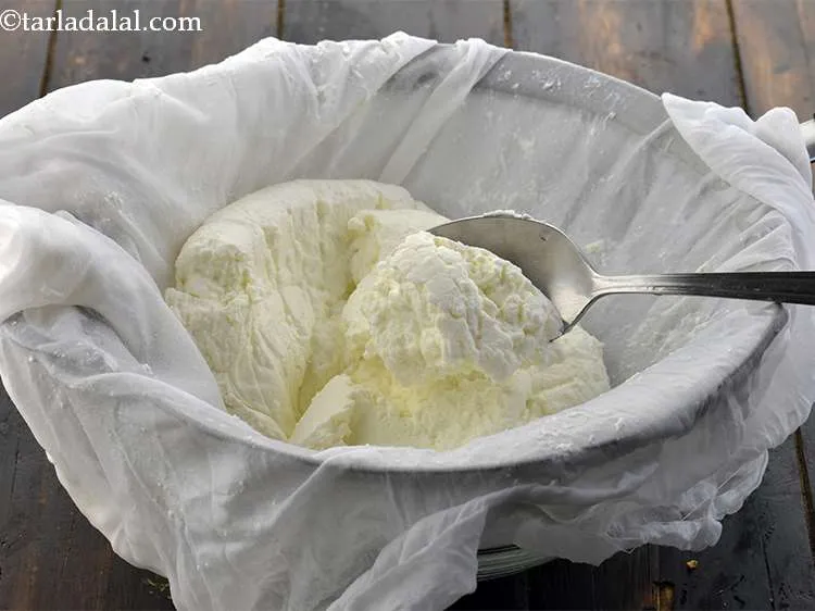 Step 9 – Squeeze the curds in the muslin cloth to remove all the excess water and discard …