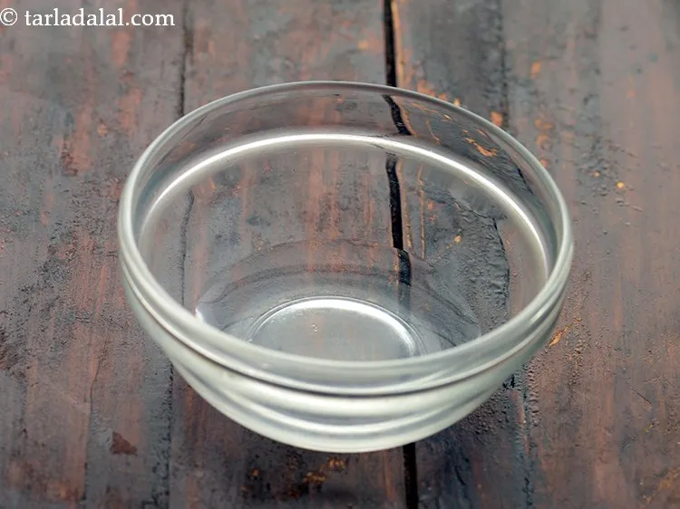 Step 2 – Before we begin making <strong>quick and easy kesar elaichi shrikhand</strong>, in a small bowl, take …