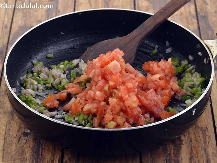 Step 16 – Add the tomatoes. Use red and firm tomatoes and chop them finely using a sharp …