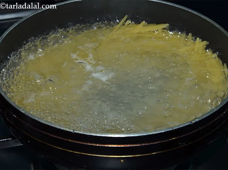 Step 4 – Add the raw spaghetti. You can break it a little if you wish to.