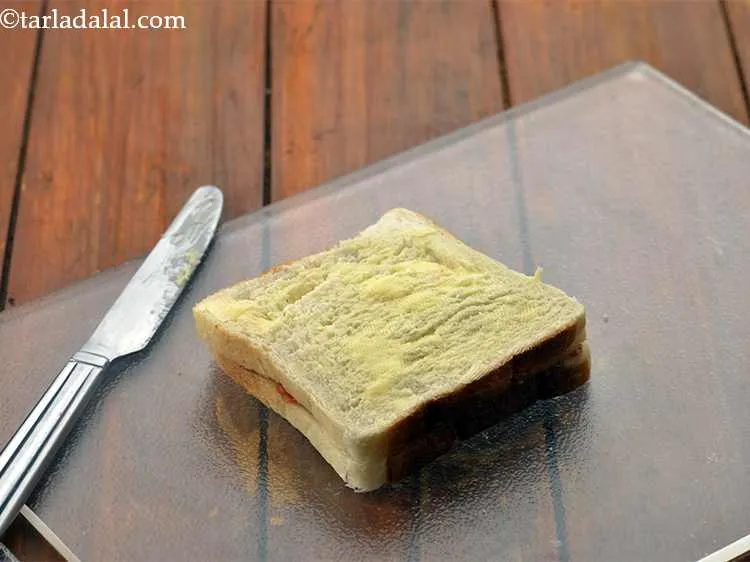 Step 13 – Brush ? tsp of butter evenly over it.