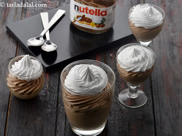 Step 11 – To garnish&nbsp;Nutella mousse&nbsp;glass, put the beaten whipped cream into a piping bag with a star …