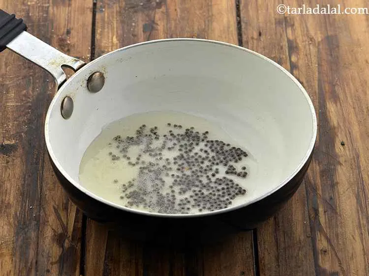 Step 9 – Add the mustard seeds. Wait for the mustard seeds to splutter.