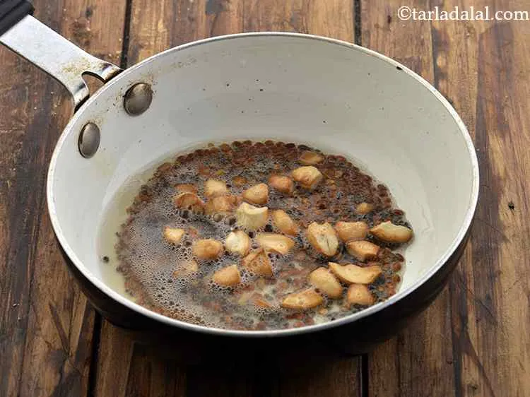 Step 11 – Add the cashewnuts. Saut? till they are light golden in colour.