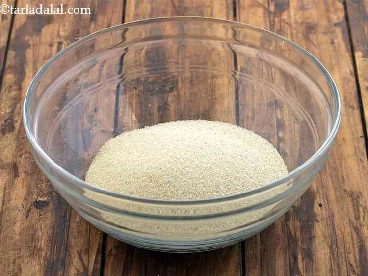 Step 1 – To make <strong>Sooji Idli batter</strong>, first in a deep bowl, take 1 cup rava /sooji …