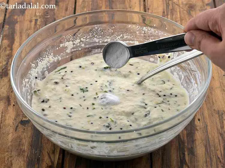 Step 16 – Just before steaming, add the fruit salt and 2 tsp of water over the tempering …