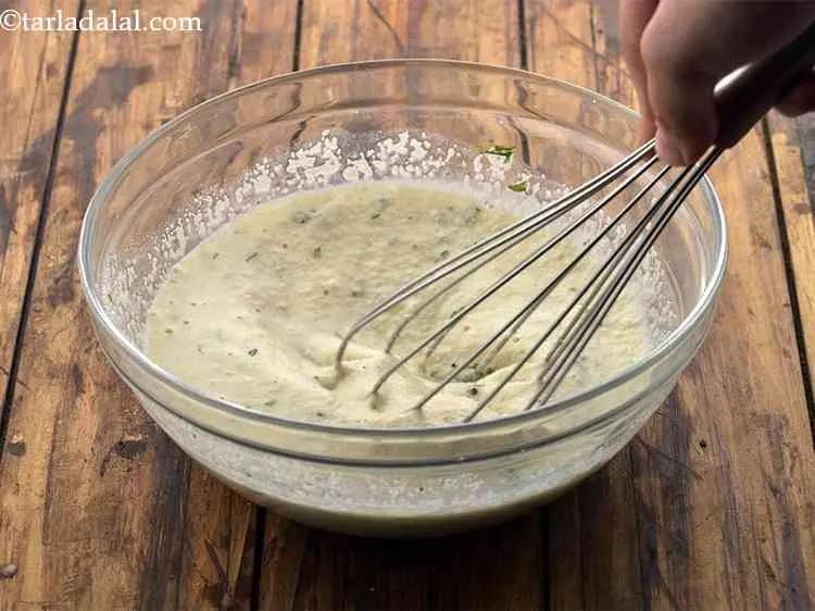 Step 5 – Mix&nbsp;<strong>Sooji Idli batter&nbsp;</strong>well with the help of a whisk. Ensure the batter is completely lump-free.