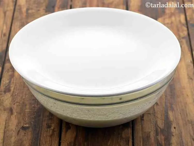 Step 6 – Cover with a lid and keep aside for 10 minutes. This&nbsp;<strong>Ravi Idli</strong>&nbsp;batter does not require …